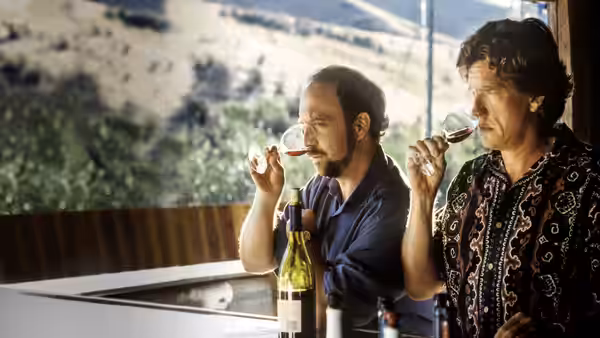 Miles (Paul Giamatti) and Jack (Thomas Haden Church) taste wine side by side by a large window