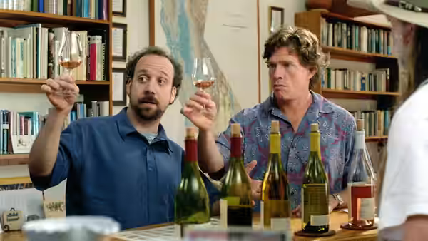 Miles (Paul Giamatti) and Jack (Thomas Haden Church) examine glasses of wine in a tasting room