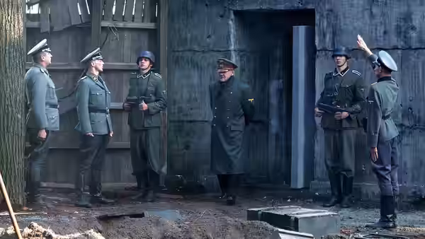 Group of German officers gathered outside a concrete bunker entrance