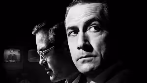 Edward R. Murrow (David Strathairn) looking upward beside a colleague