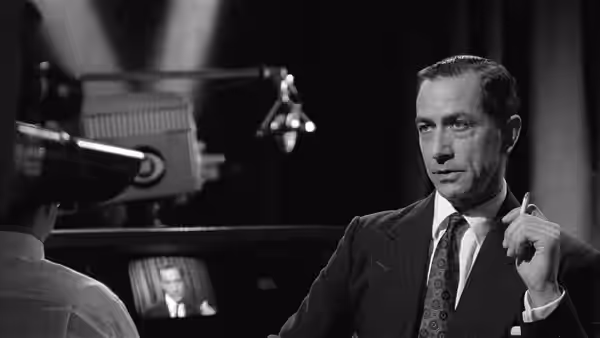 Edward R. Murrow (David Strathairn) gesturing while holding a cigarette