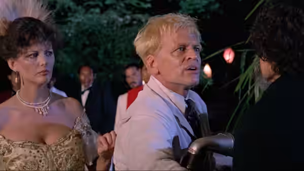 Fitzcarraldo (Klaus Kinski) beside Molly (Claudia Cardinale) at a nighttime event