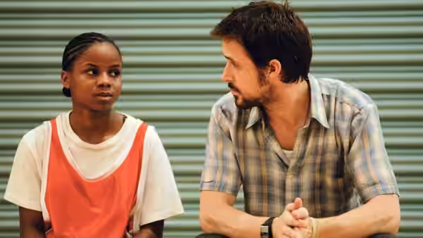 Drey (Shareeka Epps) and Dan Dunne (Ryan Gosling) facing each other intently