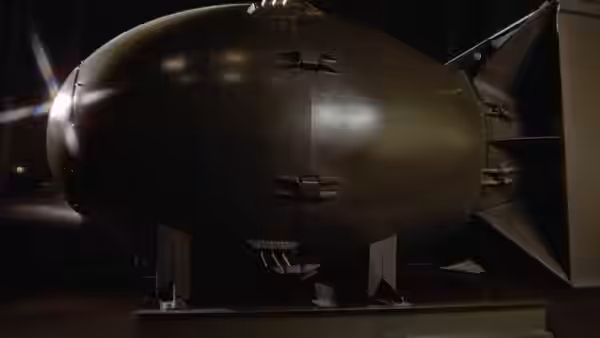 large dark bomb displayed on stand in dimly lit interior
