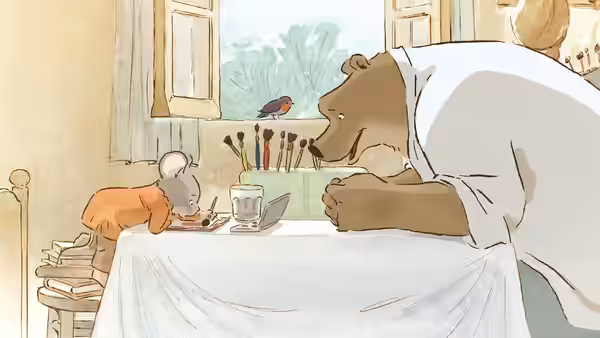 Ernest leaning over a table while Célestine draws on paper