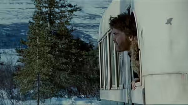 Christopher McCandless (Emile Hirsch) looking out the bus window in snow