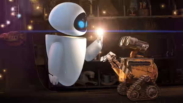 EVE and WALL·E examining a glowing object inside a spaceship