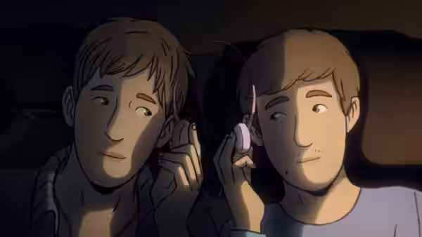 Two young men lie side by side holding earbuds in the dark