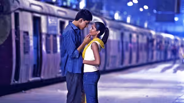 Jamal (Dev Patel) and Latika (Freida Pinto) embrace on a train platform