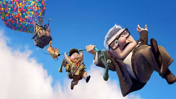 Carl Russell and Dug flying through the sky beneath colorful balloons