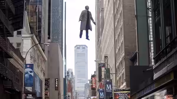 Riggan (Michael Keaton) floating above a busy city street