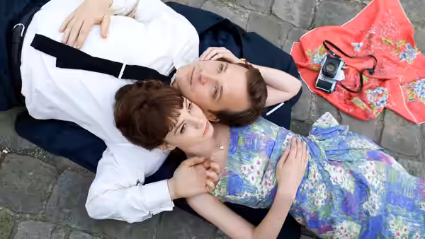 Jenny (Carey Mulligan) lies beside David (Peter Sarsgaard) on a stone courtyard