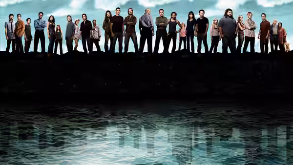 Silhouetted figures standing on a cliff above water with city lights reflected below