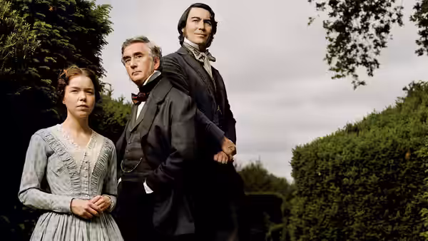 Esther Summerson (Anna Maxwell Martin) stands with John Jarndyce and Richard