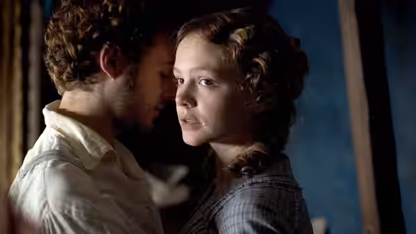 Ada Clare (Carey Mulligan) stands close to Allan Woodcourt in profile