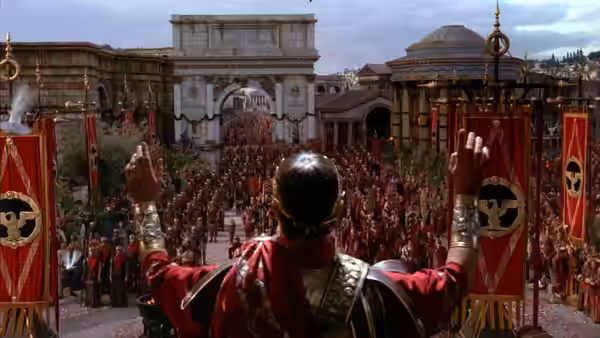 A Roman commander with raised arms overlooks a vast crowd in the forum