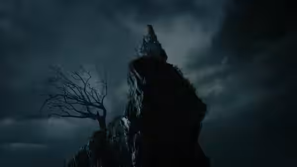 A lone figure stands atop a jagged rock formation beneath storm clouds