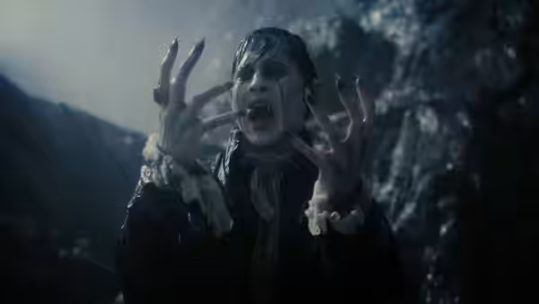 Barnabas Collins (Johnny Depp) reaches forward, screaming amid dark rocky surroundings