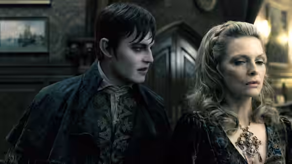 Barnabas Collins (Johnny Depp) stands beside Elizabeth Collins Stoddard (Michelle Pfeiffer) indoors