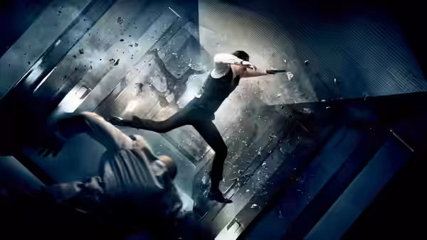 Joseph Gordon-Levitt as Arthur kicking a man in a tilting corridor