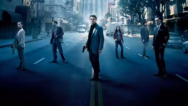 Men and a woman standing armed on an empty city street