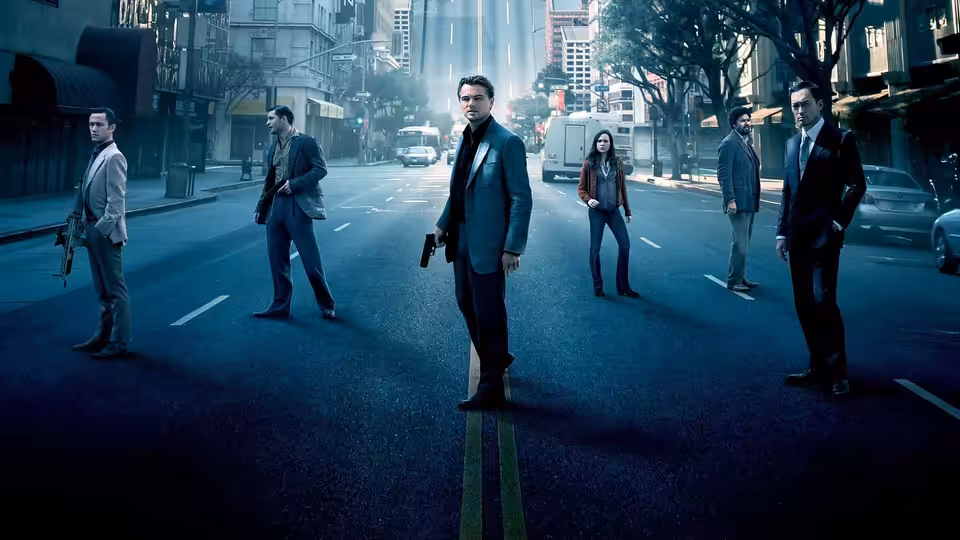 Men and a woman standing armed on an empty city street
