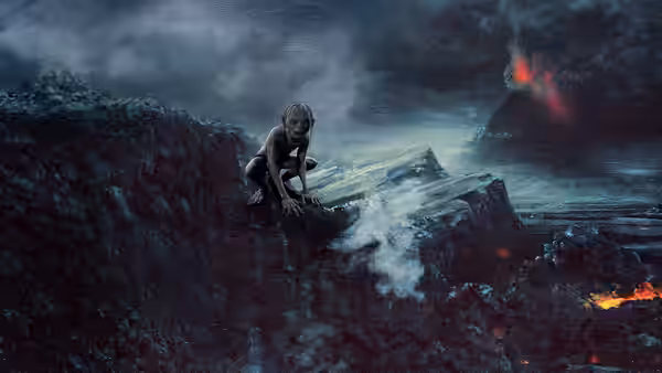 Gollum (Andy Serkis) crouching on rocks above streams of molten lava