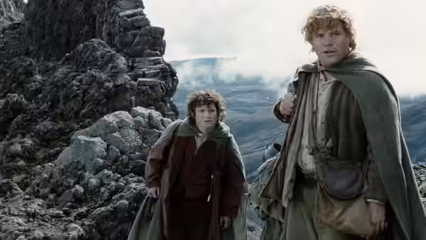 Frodo (Elijah Wood) and Sam (Sean Astin) standing on a rocky slope