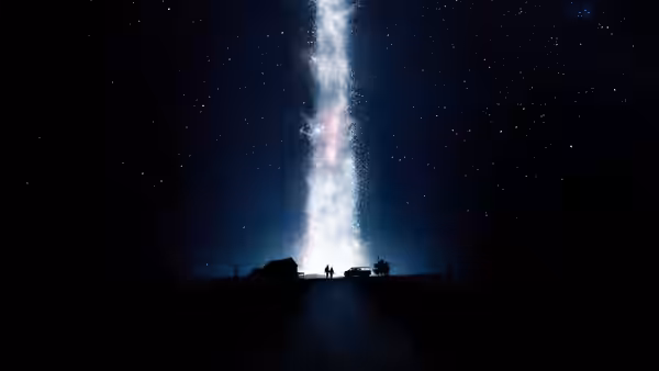 silhouetted figures on a road under the Milky Way at night