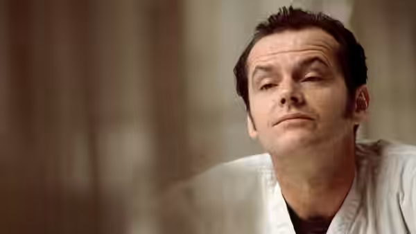 McMurphy (Jack Nicholson) gazing upwards in a close-up portrait