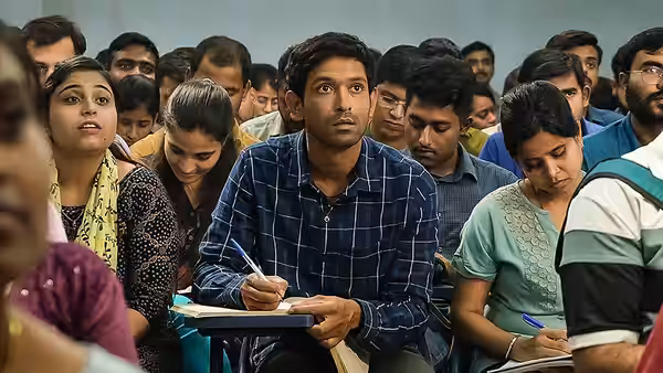 Manoj Kumar Sharma (Vikrant Massey) writing in a crowded exam hall