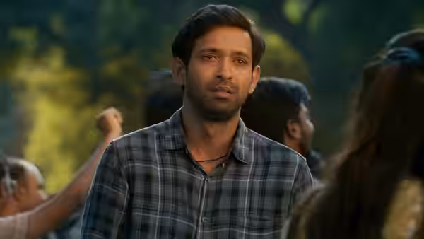 Manoj Kumar Sharma (Vikrant Massey) standing outdoors with a serious expression