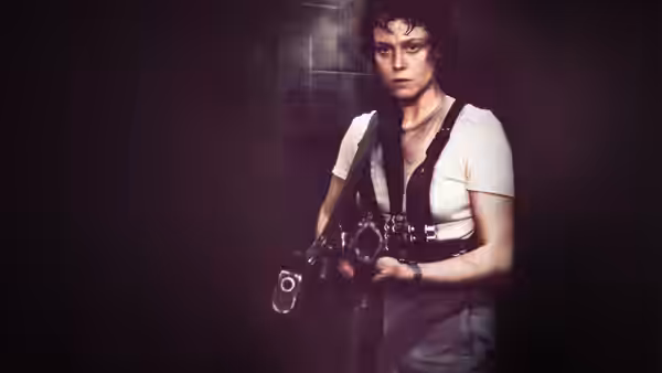 Ripley (Sigourney Weaver) grips a weapon in a dark tiled corridor
