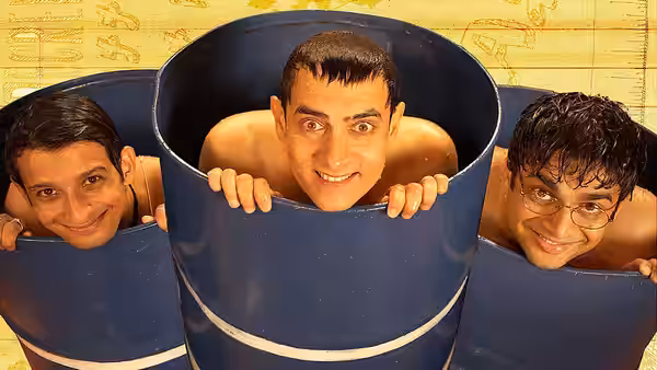 Ranchoddas "Rancho" Chanchad (Aamir Khan) and two friends peering from blue barrels