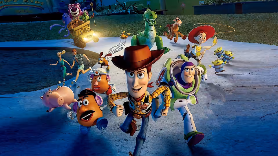 Woody and Buzz Lightyear leading toys running down a paved road at night