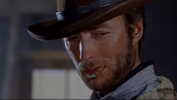 Manco (Clint Eastwood) in close-up with cigarillo in mouth