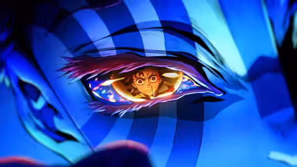 a girl with brown hair peering from inside a large striped eye