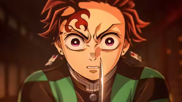 Tanjiro Kamado (Natsuki Hanae) gripping a sword with a fierce stare
