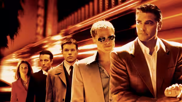 Danny Ocean (George Clooney) and crew standing together on the Las Vegas strip