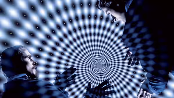 Robert Angier (Hugh Jackman) and Alfred Borden (Christian Bale) facing a spinning spiral