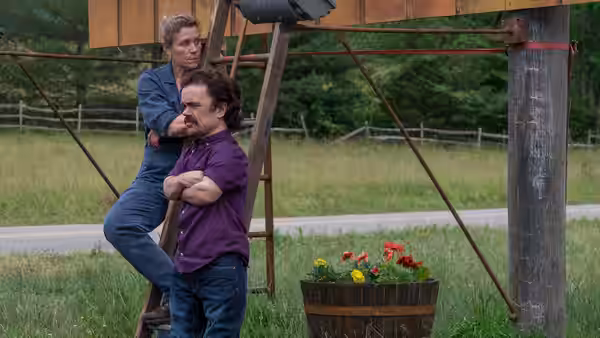 Mildred (Frances McDormand) and Charlie (John Hawkes) stand on a ladder outdoors
