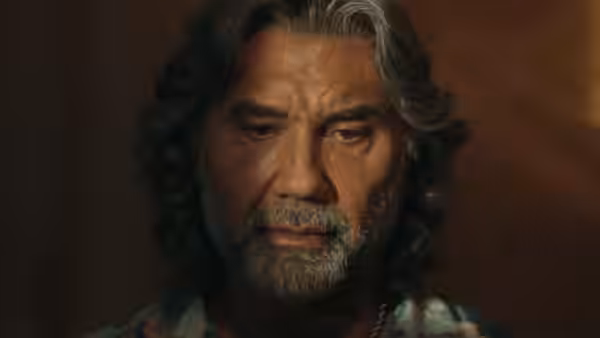 Eddie (Dave Bautista) looks down pensively