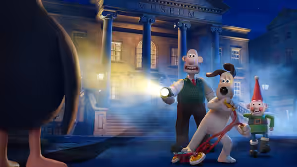 Wallace, Gromit and Norbot investigate outside a museum at night as a flashlight beams toward them
