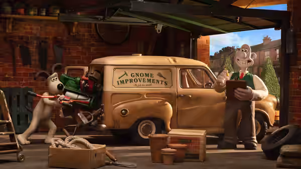 Wallace stands beside the Gnome Improvements van while Gromit loads garden tools in the workshop