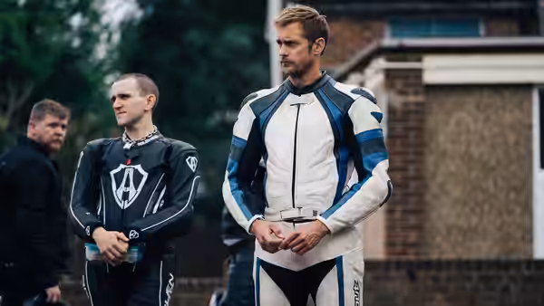 Ray (Alexander Skarsgård) stands with two fellow motorcycle riders outside a house