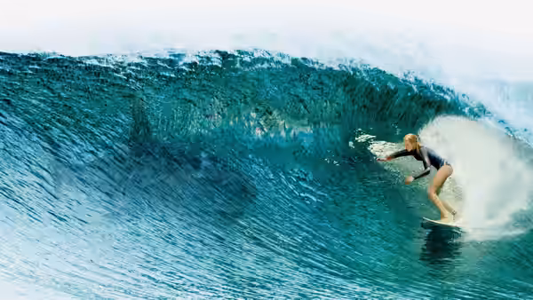 Nancy Adams (Blake Lively) surfs along the face of a towering wave