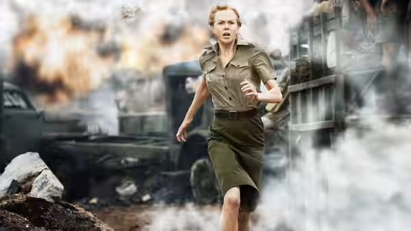 Lady Sarah Ashley (Nicole Kidman) runs through smoke and wreckage beside a train