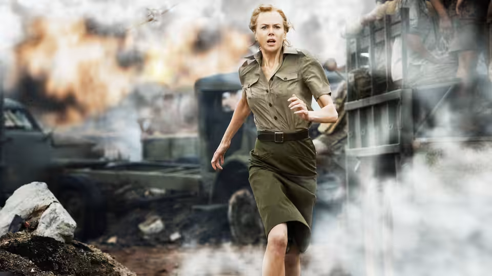 Lady Sarah Ashley (Nicole Kidman) runs through smoke and wreckage beside a train