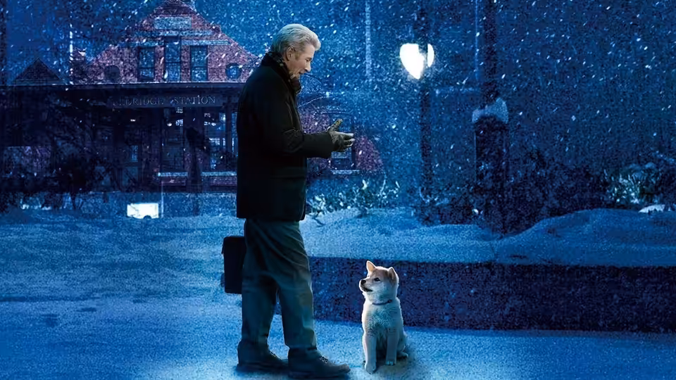 Parker Wilson (Richard Gere) stands in falling snow beside a seated dog