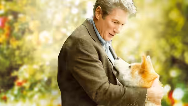 Parker Wilson (Richard Gere) hugs his dog in a garden